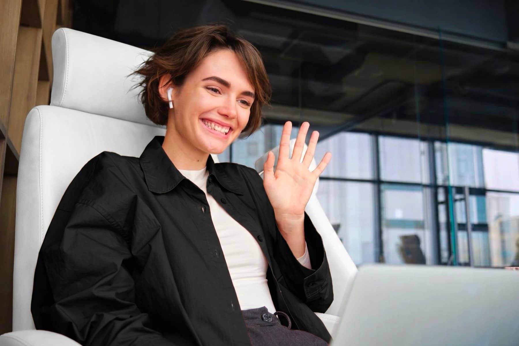Operator waving on a video call